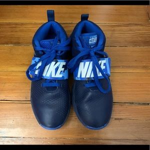 Nike team hustle sneakers.